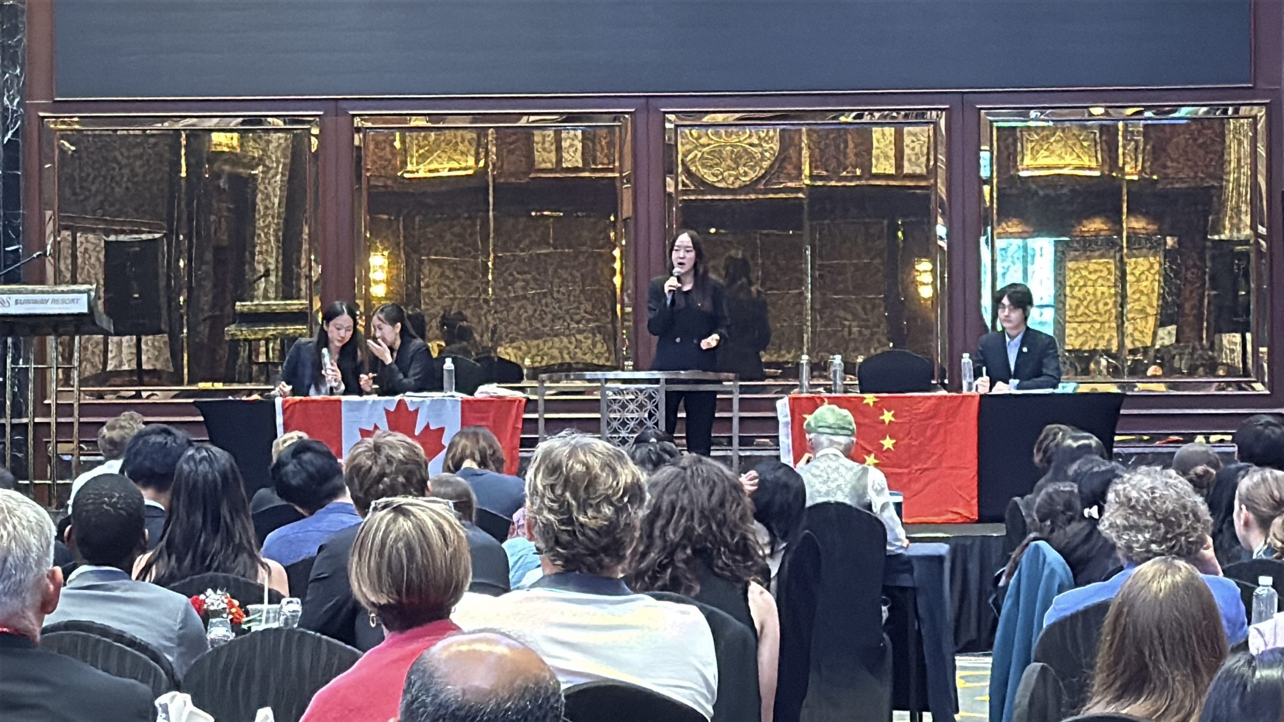 Caridee Chau in Debate Grand Finals at Malaysia Worlds 2025